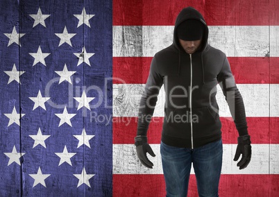 man with covered face against american flag