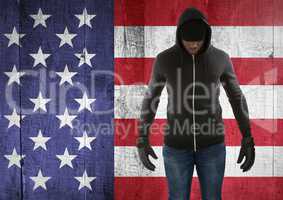 man with covered face against american flag