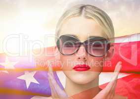 Blond woman wearing sunglasses against american flag in the background