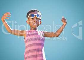 Boy in sunglasses hands out against blue background