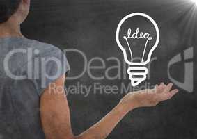 Back of business woman with 3d lightbulb graphic in hand and flare with grunge overlay against grey