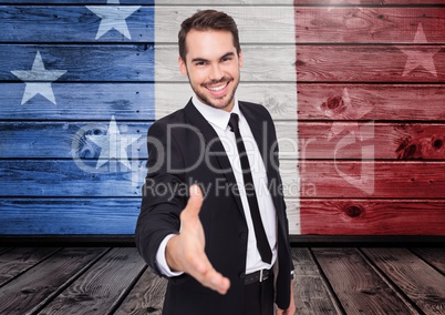 Business man shaking his hand against american flag