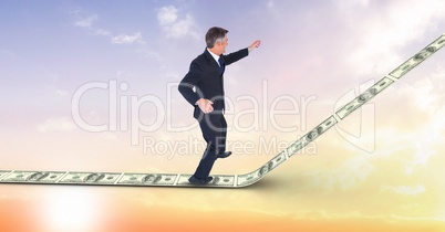 Digital composite image of businessman standing on 3d money walkway