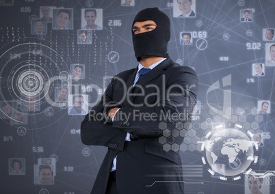 Businessman with hood and arms crossed in front of digital background