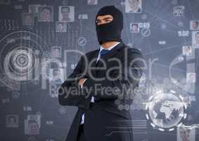 Businessman with hood and arms crossed in front of digital background