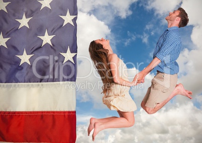 Couple jumping in the sky against american flag