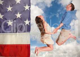 Couple jumping in the sky against american flag