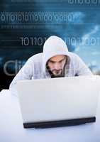 Hacker using a laptop in front of blue background with digital numbers