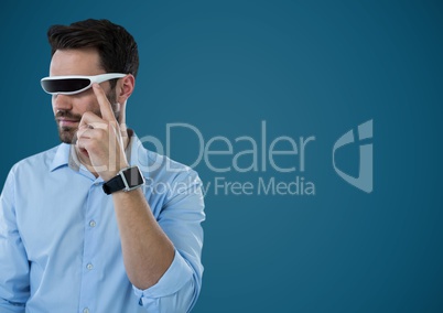 Man in virtual reality headset against blue background