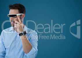 Man in virtual reality headset against blue background