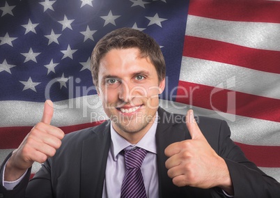 Business man with thumb up against american flag