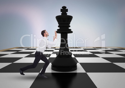 Business man pushing 3D chess piece against purple abstract background