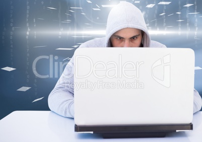 Hacker using a laptop in a room