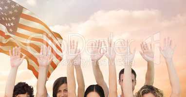 Hands up against fluttering american flag background