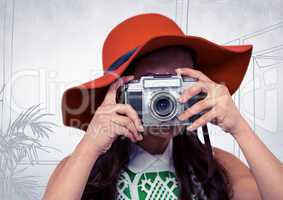 Millennial woman with sunhat and camera against white hand drawn office