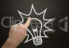 Hand pointing at blackboard and 3d white lightbulb graphic