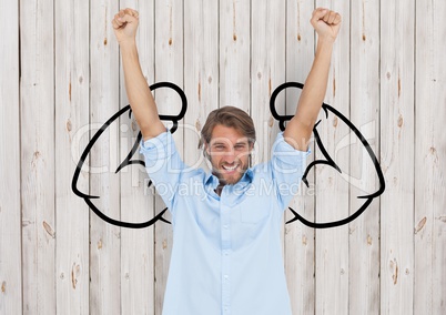 happy young businessman hands up in front of fists draw on wood wall