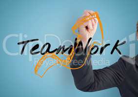 Businessman hand finishing the arrow of the graphic about TEAM WORK