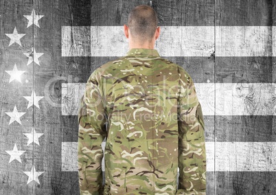 Rear view of military against black and white american flag
