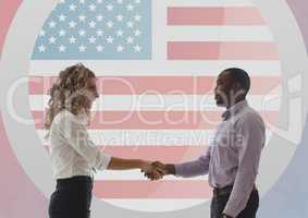 Business people shanking teheir hands against american flag