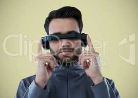 Man in virtual reality headset against light green background