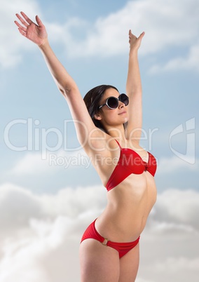 Woman in red bikini against sunny sky