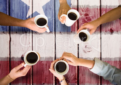 Friends having a coffee together against american flag