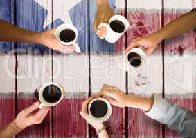 Friends having a coffee together against american flag