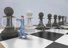 Business man pushing 3D chess piece against grey wall