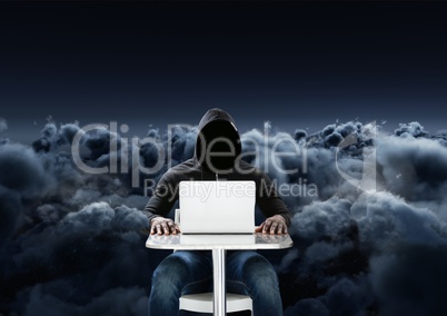 Hacker using a laptop in front of 3d cloudy black background