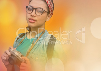 Smiling photographer standing in colored fog