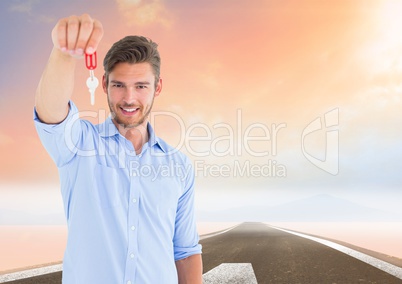 Man Holding Keys with road