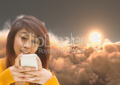 Woman Texting in 3D clouds with sunset