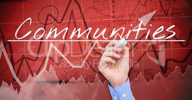 Businessman hand writing COMMUNITIES  on the screen. Stock market, red background