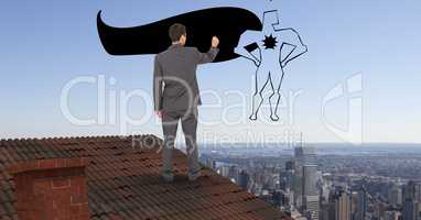 Rear view of businessman on roof drawing 3d super hero in midair