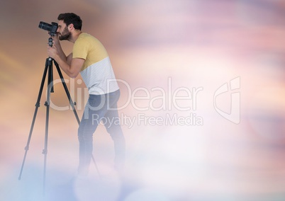 Photographer taking pictures against glowing background