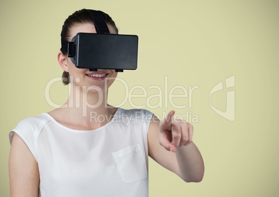 Woman in virtual reality headset against light green background