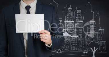 Business man mid section with card against 3D navy background with city doodle