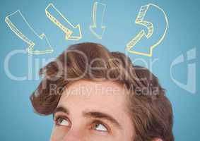 Top of man's head looking at yellow arrows against blue background