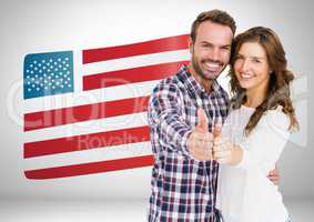 Couple thumbs up on american flag background