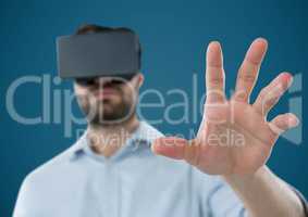 Man in virtual reality headset against blue background