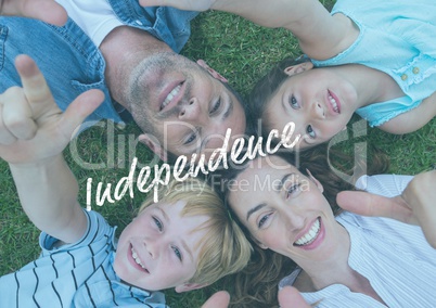 Smiling american family lying down on the grass