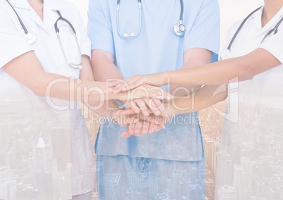 Doctors putting their hands together