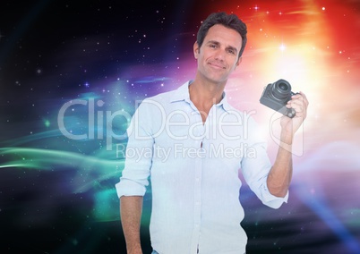 Photographer holding a camera against galaxy background