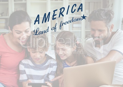 Happy american family looking at the digital tablet for the 4th of July