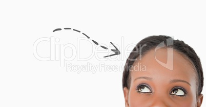 Top of woman's head looking at grey downward arrow against white background