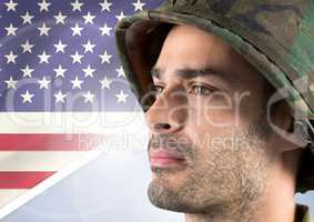 Close-up of a soldier looking horizon against american flag background