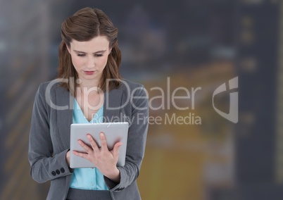 Woman on tablet in night city