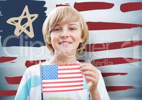 Boy holding american flag against hand drawn american flag and blurry blue background