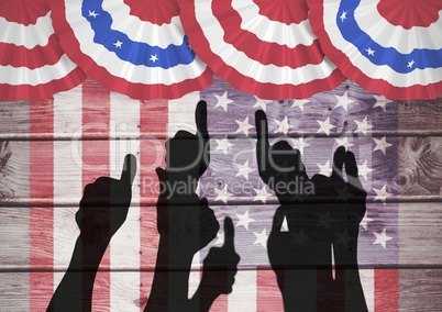 Thumbs up silhouettes against wooden american flack background
